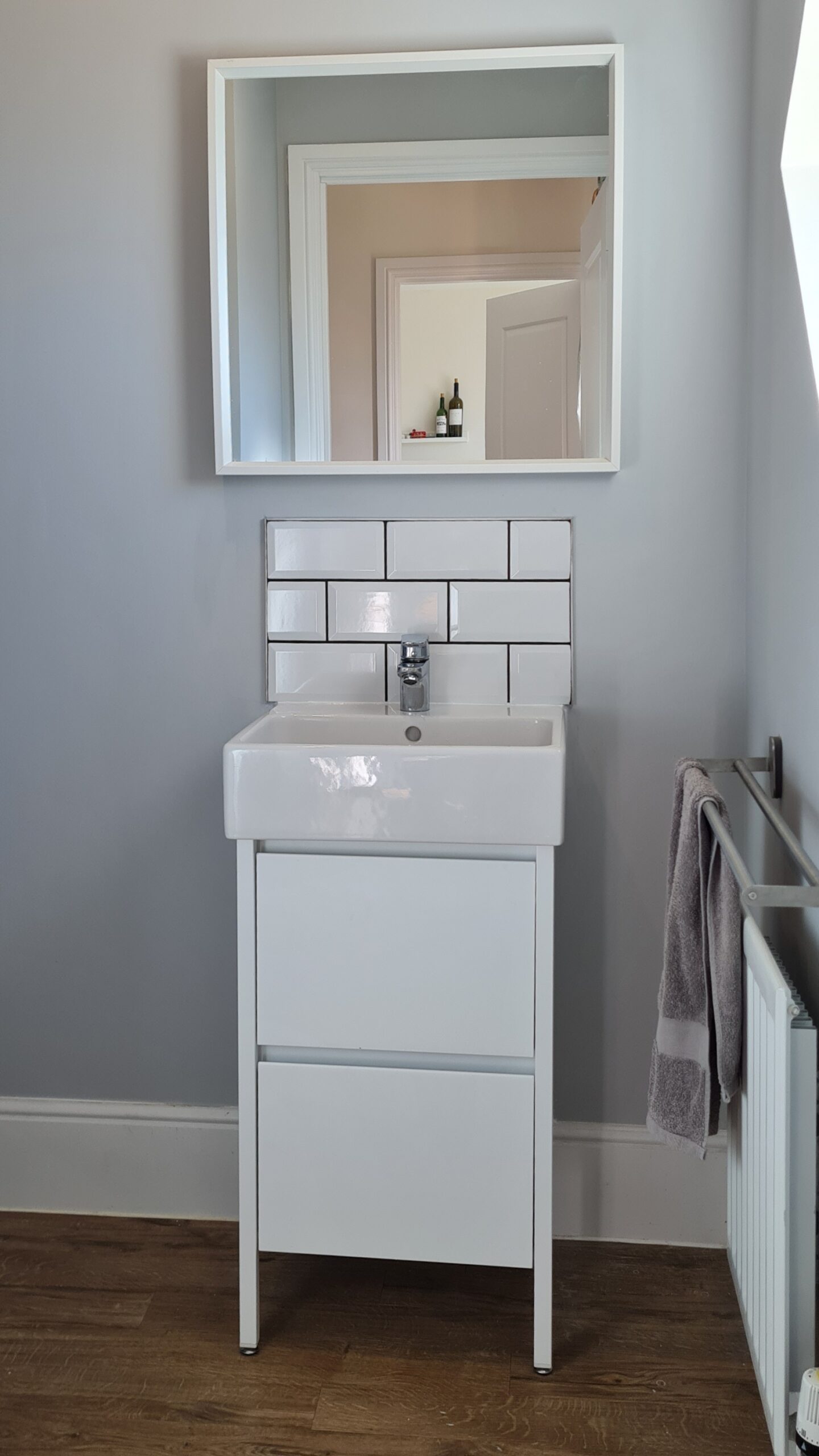 New sink fitted with storage unit and splashback